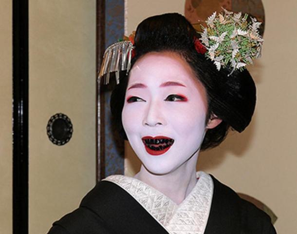 Black stained teeth of a Japanese woman (Ohaguro)
