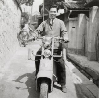 Founder of Asics - Kihachiro Onitsuka riding a bike