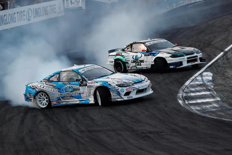A car racing event with multiple Japanese sports cars on the track.