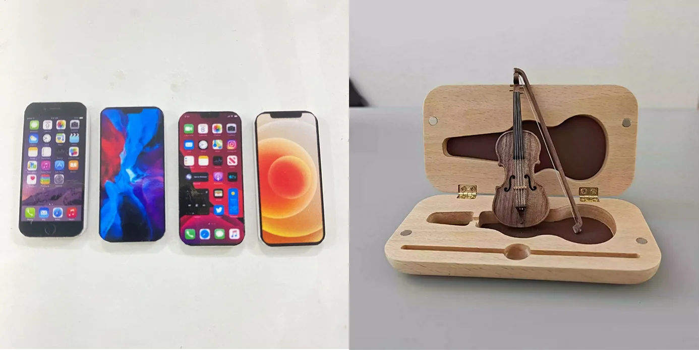 Tel&eacute;fonos modernos y viol&iacute;n en miniatura.