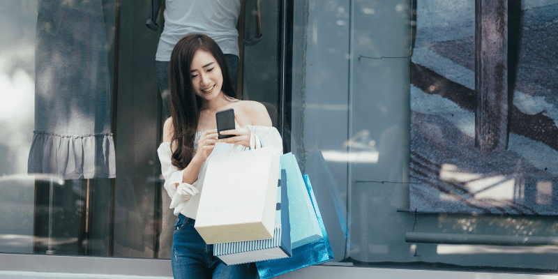 woman buying brand bags in japan